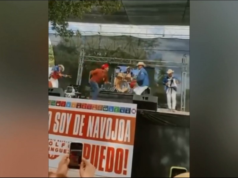 Abanderado de MC causa controversia, utiliza rosario mayo durante baile