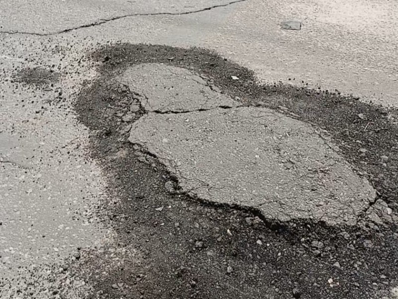 Afectan lluvias obras de bacheo