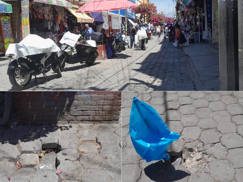 Agustín A Cacho con hundimientos, utilizada como estacionamiento, hay molestia