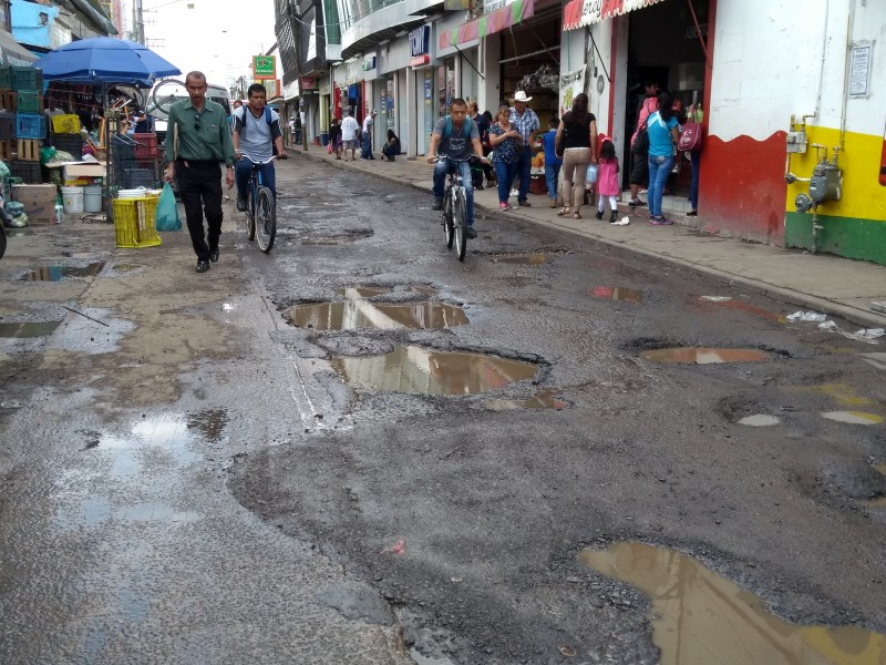 Calle céntricas llenas de baches