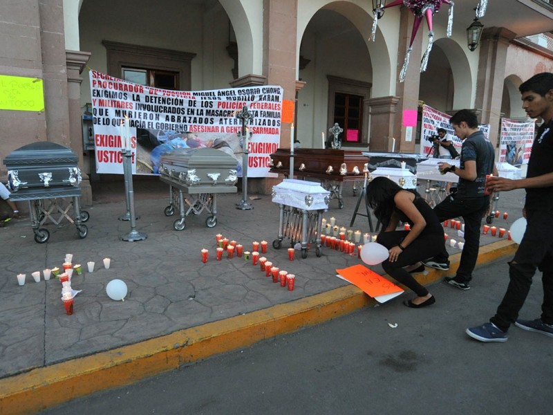 Formal prisión a federales por matanza en Apatzingán
