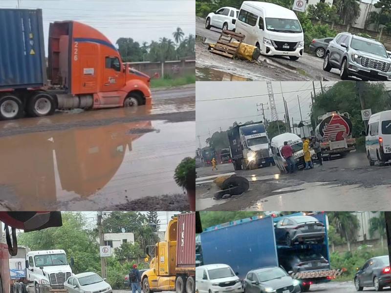Grandes baches en la Lázaro Cárdenas-Zihuatanejo daña varios vehículos diariamente