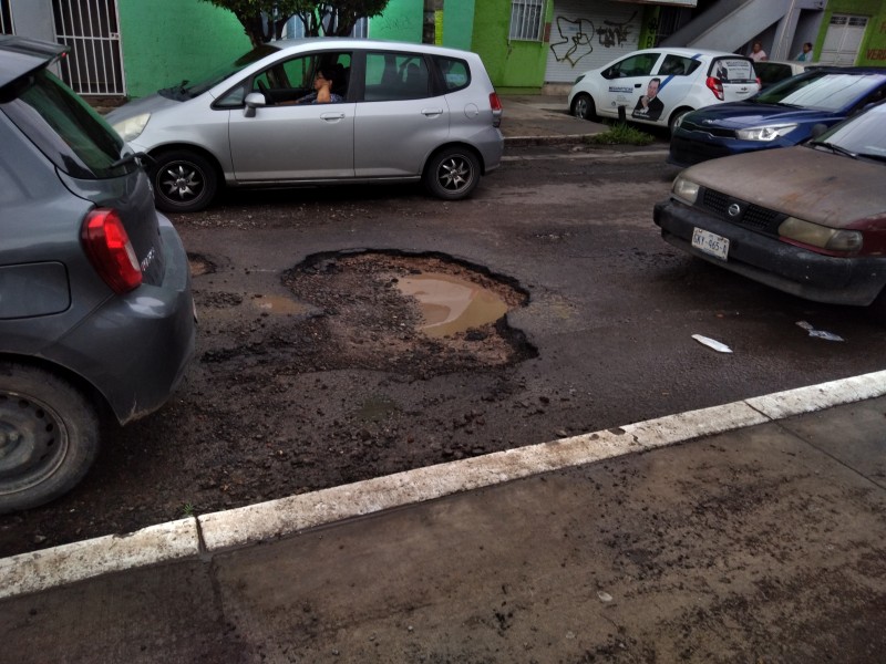 Lluvias afectan el pavimento de vialidades