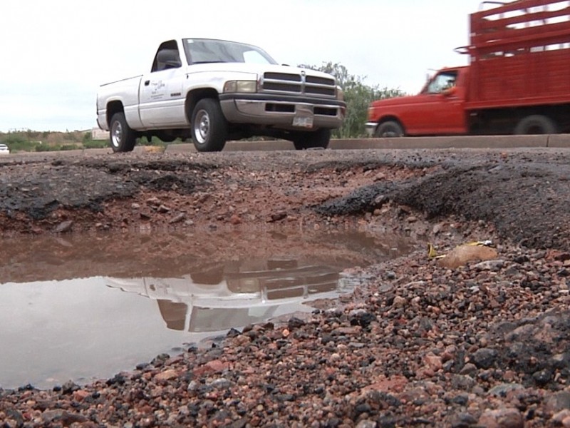 Reportan calle calzada industrial en malas condiciones